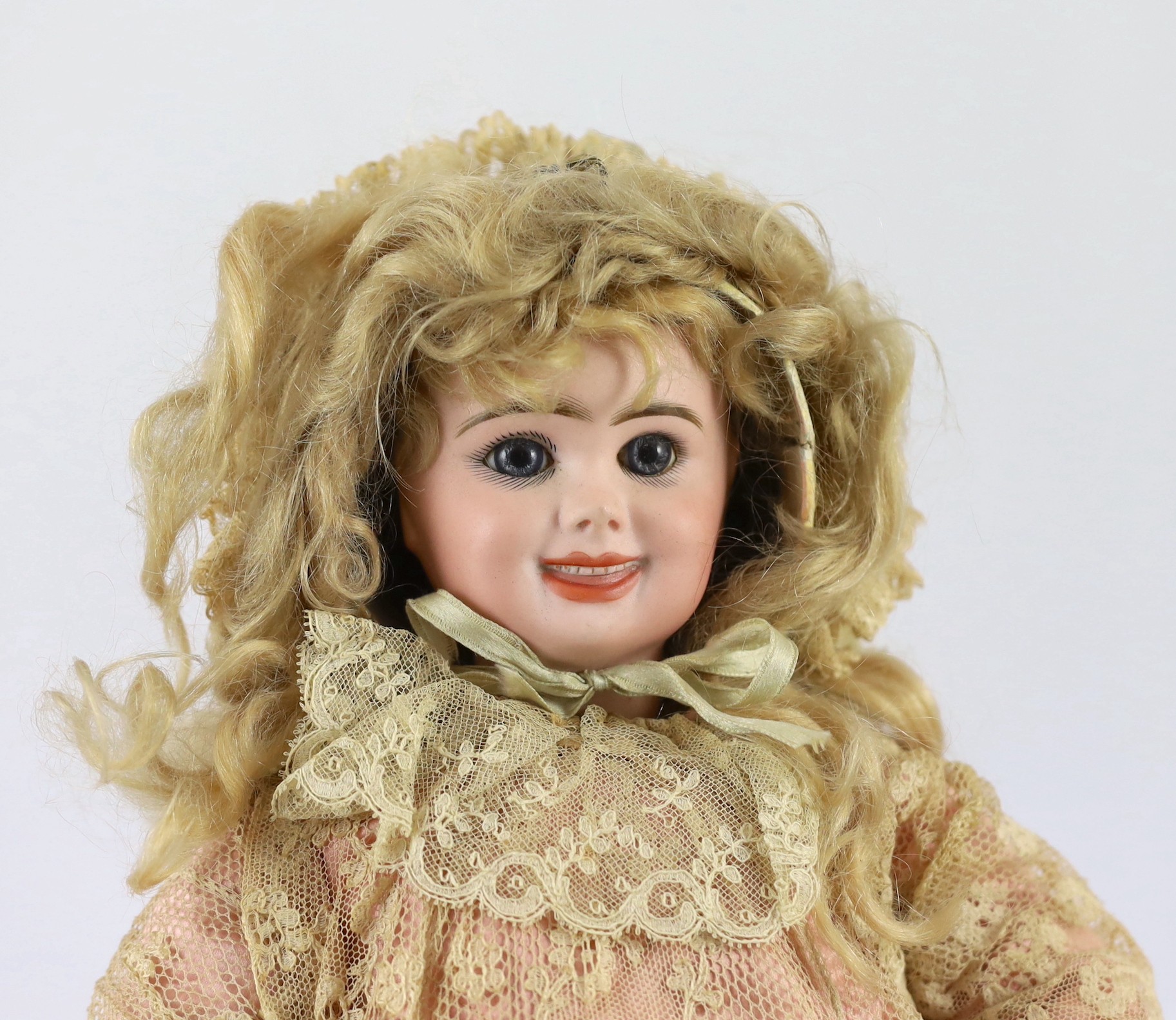 A fine and rare Jumeau pressed bisque two-faced doll, French, circa 1885, 18in.